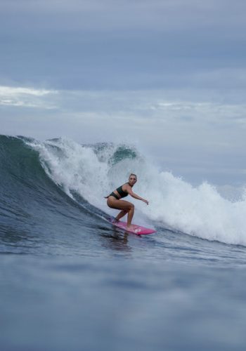 high waves and a surfing girl
